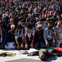 Attendees of the National March on Washington: Free Palestine on Nov. 4 pause for prayer. PHOTO BY DREW ANGERER VIA GETTY IMAGES